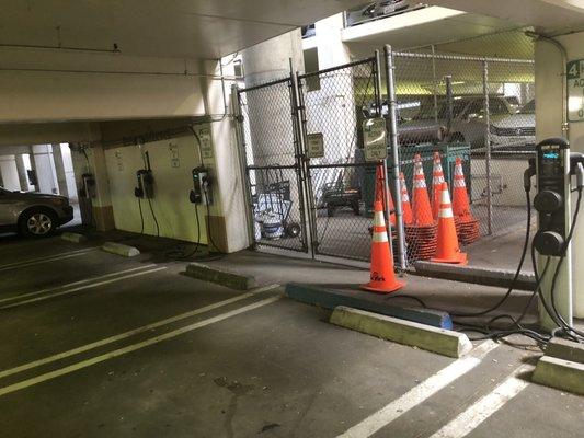 Electric car charging spots (located near disabled parking) with about 6 spots at the bottom level.