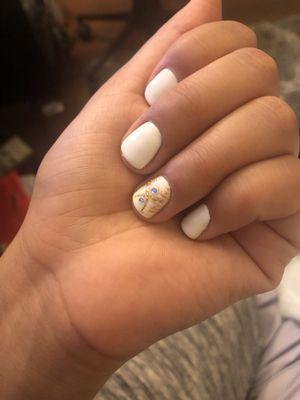 White gel manicure with gold accent for the holidays.