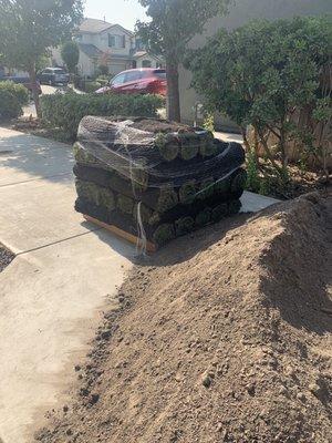 Sod moved up driveway next to Amazing TopSoil from Brentwood Decorative Rocks