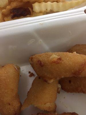 Maybe bacon bits or something stuck to my fried cheese curds