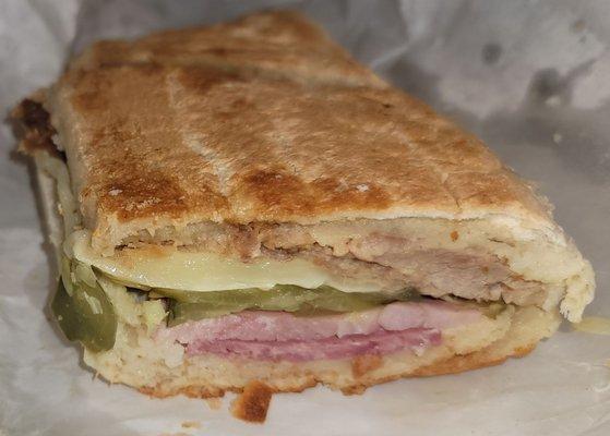 Half of a Cuban sandwich