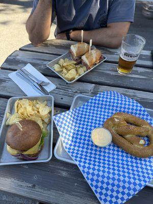 Burger, pretzel and pastrami sandwich.