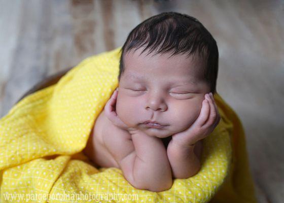 Newborn Head in Hands