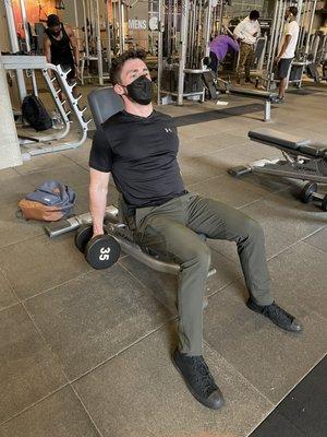 Seated dumbbell curl.