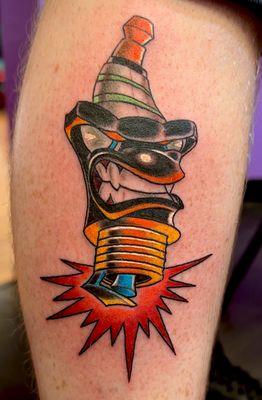 Mean New school spark plug tattoo done by Mike Sizemore at Kill Em All Tattoo