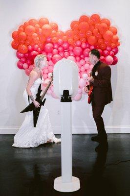 Bride & Groom having fun with the photo booth at the wedding