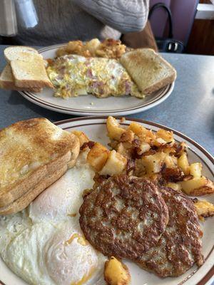 Two eggs over easy sausage, patty home fries, Italian toast. Vegetable omelette without the peppers and sourdough bread and home fries.