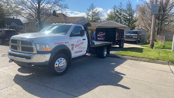 One of our 10 yard driveway safe dumpsters being delivered.