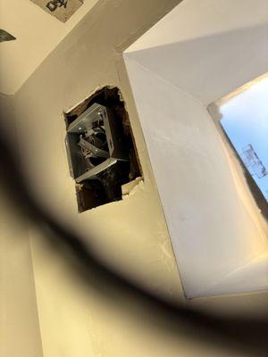 Installing exhaust fan into bathroom ceiling