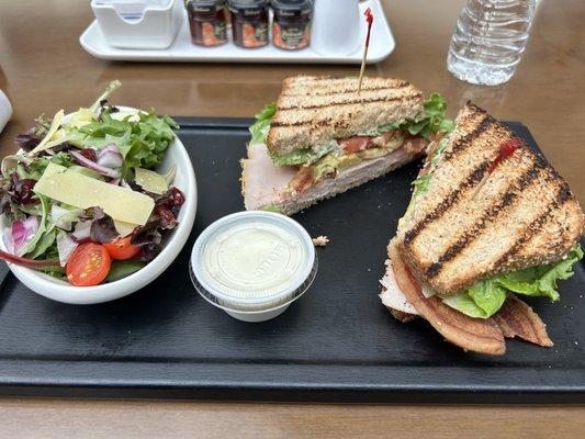 Turkey club sandwich with side salad