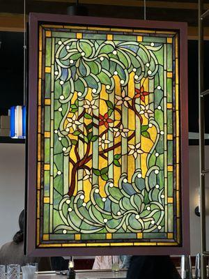 Gorgeous details in the decor! Beautiful stained glass window behind the bar.