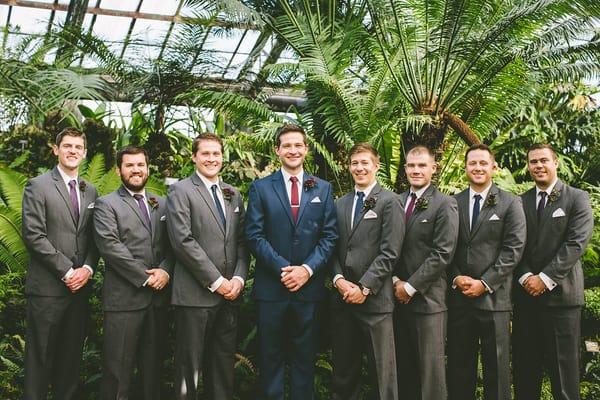 Grey suits rented for groomsmen from Formally Modern to complement the groom!