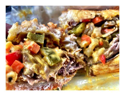 NICK's ON NORTH.Amazing Cheesy Italian Beef with Sweet & Hot Peppers and Melted Cheddar Cheese. Only not to beefy for me! More Beef Please!