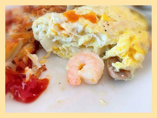 Inside look at the Shrimp and mushroom omelette $13.50