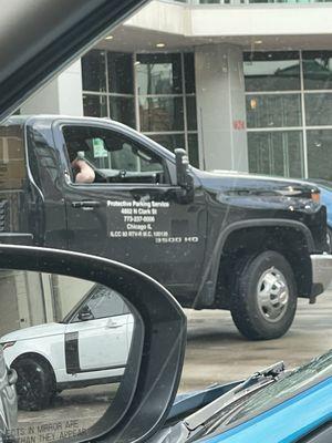 Tow truck company name, address, and phone number.