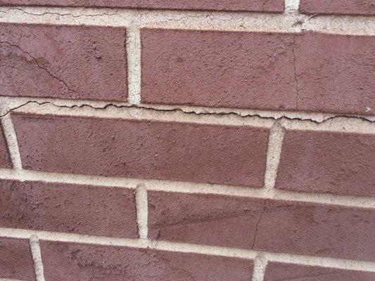 Stucco crack left completely un-repaired!