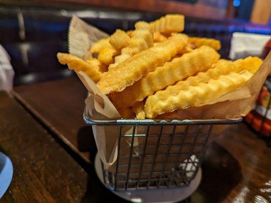 The fries are served in a fryer basket. Nice touch!