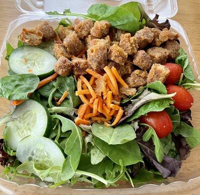 Excellent #FriedHouseSalad. Fresh organic spring lettuce blend topped with cucumbers, tomatoes, carrots, & chick'n tenders