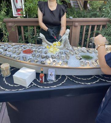 Display of oysters in a boat with a mermaid :)