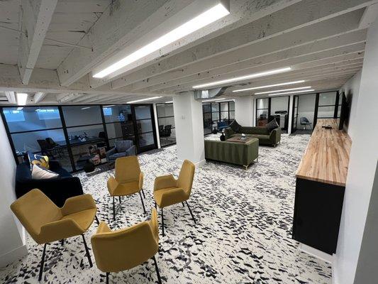 Lower level. Plenty of space! Meetings, work, or just lounge on the couches.