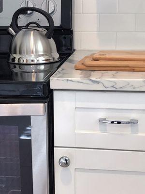 Custom cabinets, custom quartz countertops and a new tile backsplash.