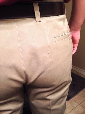 Pressed pants with a button pressed into them