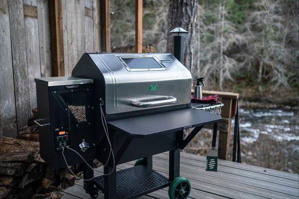 Green Mountain Prime Daniel Boone Pellet Grill with WiFi and a Stainless Steel hood.