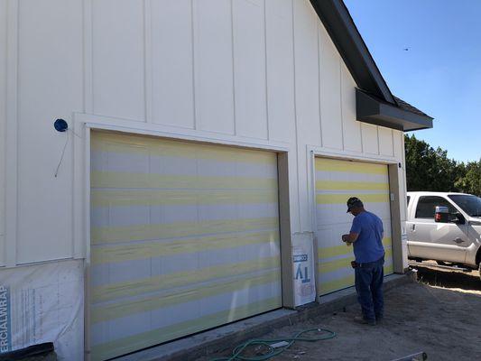 White in color garage doors completed