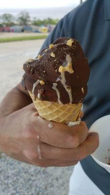 Chocolate soft serve with hard shell chocolate and nuts.