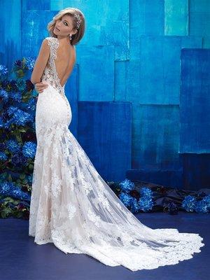 Allure Bridal style #9409 an amazing fit and flair lace gown with a very low beaded back.