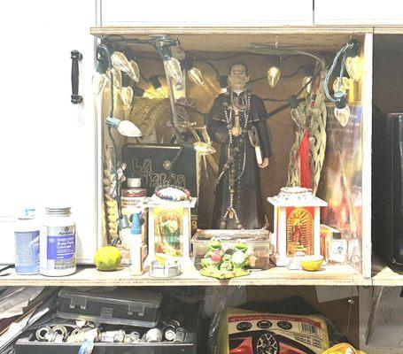 Alter for Santa Toribio Romo in the shop. BUY TIRES FROM TONY!