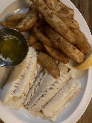 Broiled cod plate with garlic wedges