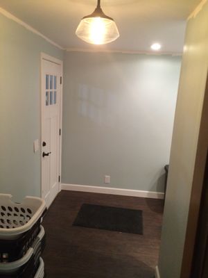 Laundry room addition in a garage.