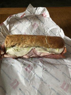 The Gargantuan on a wheat sub roll packed with lunch meat