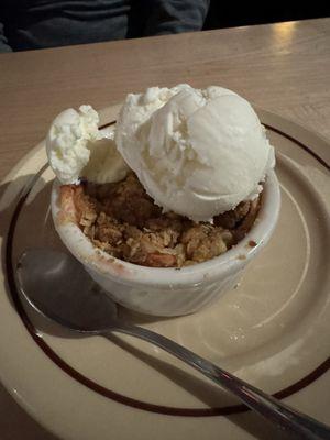 Warm fruit crisp and vanilla ice cream