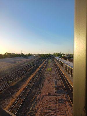 Railroad tracks below underneath bridge