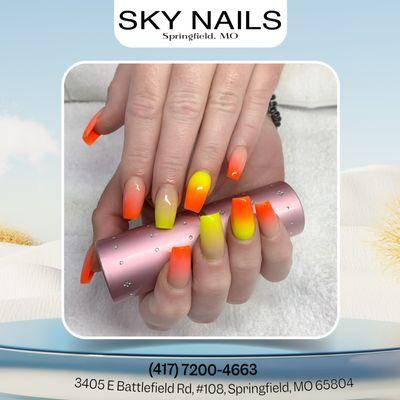 Your nails are a fiery masterpiece! Orange and yellow ombre for a touch of summer magic.