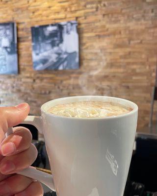 Hot chocolate with whipped cream in bar area