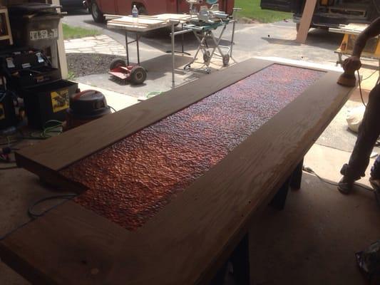 Hammered copper bar. Stained oak