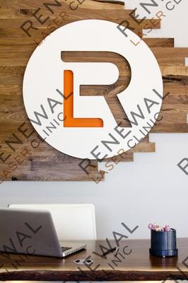 Logo behind reception desk #renewallaser #tattooremovalmn