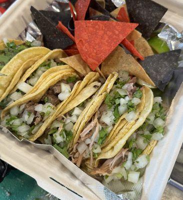 Pictured are Steak and Carnitas Street Tacos with house made chips and Salsa Fresca