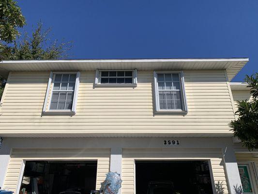 2nd floor windows with locks on the inside for easy fastening and no ladder required. White.