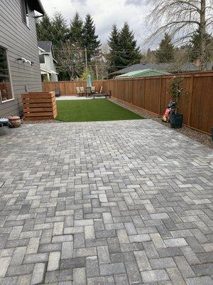 Two paver patios, decorative hvac cover, turf and stained fence - dream backyard!