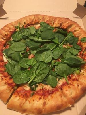 Spinach not even cooked on it and pizza is cold