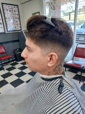 Mid skin fade by Robert