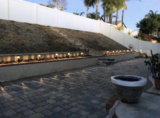 Paver installation with retaining wall and lights