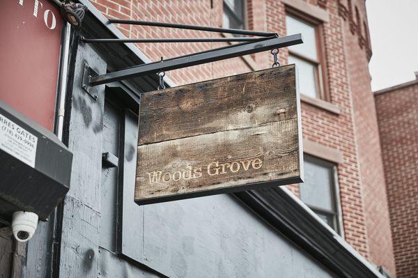 Exterior store sign, made from reclaimed wood.