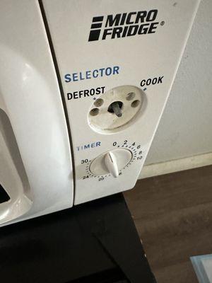 Filthy microwave with missing knob. Filthy inside out.