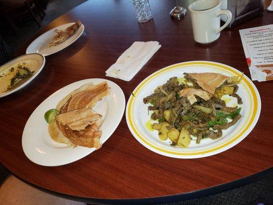 A Somali Breakfast... Notice no silverware.   Liver, onions, potatoes?? AMAZING