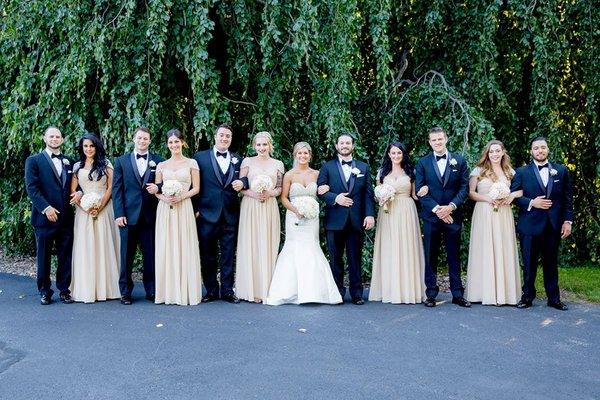 Entire bridal party in gowns tailored by us and tuxedos rented through us!